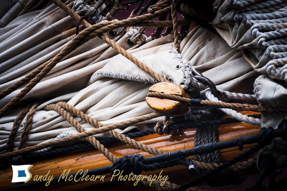 Ropes and furled sail onboard a tall ship.
