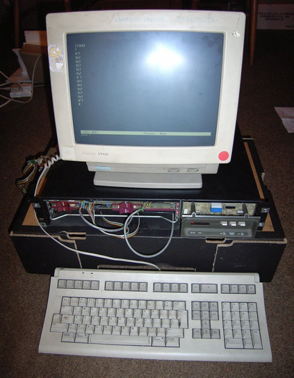 The LSI-11 A large desktop PC sized black machine with some telltale purple card pulls showing connected to a VT420 monitor. The screen has text on it, but it's just "hello there" typed one letter at a time to the pdp's "@" prompt.