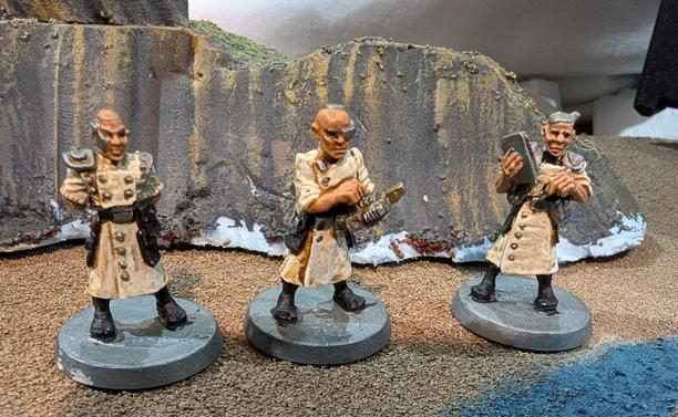 Three science fiction technician miniature figures from Satyr Arts.
