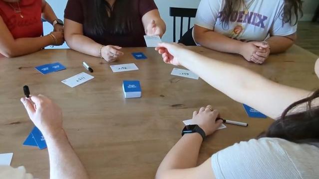 People playing the Magic Number card game being Kickstarted that's linked in this post