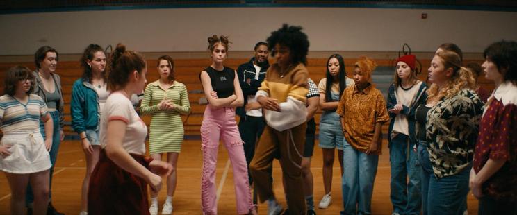 fight club training scene shows a bunch of girls standing in a circle in the gym while our two heroines PJ and Josie circle each other, anxious to throw the first punch