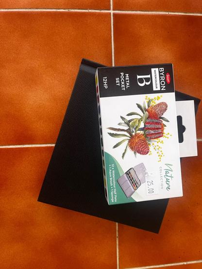 A photo showing a brand new watercolour pack and art diary. Sent from a friend, saying I inspired her to start!