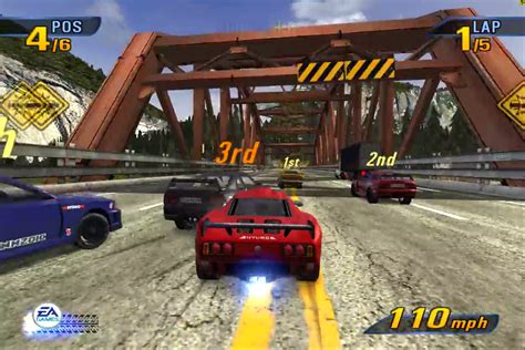 multiple cars racing infront of a bridge