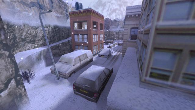In this picture you can see a small town. This is surrounded by mountains. In addition, snow lies and falls. The buildings are multi-storey. There are parked and snow-covered vehicles on the street. Among them are two normal cars, two SUVs and a van. In front of the van is a street lamp. This is on the map de_survive in the game Coubter-Strike 1.6.