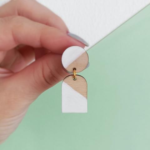 Wooden earring with white geometric lines
