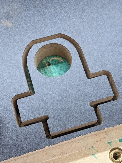 photo of the result of the CNC job that the freecad screenshot shows. It's a piece cut in black melamine mdf