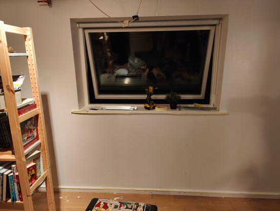 Frame and isolation installed. Drywall put up. Plaster applied. First layer of paint applied. Looks nice.