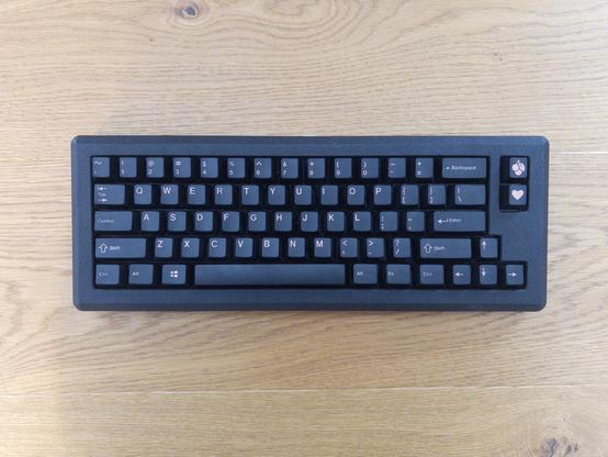 Norbauer Heavy-6 Royal Wrinkle mechanical keyboard on a wooden floor