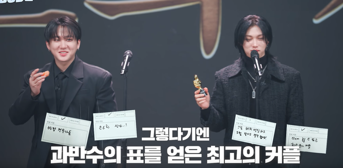 Changbin and Felix accepting the best couple awards. Handwritten ballots completed by the members are superimposed, but English translations are not provided and I can't yet read Korean well enough to translate them.