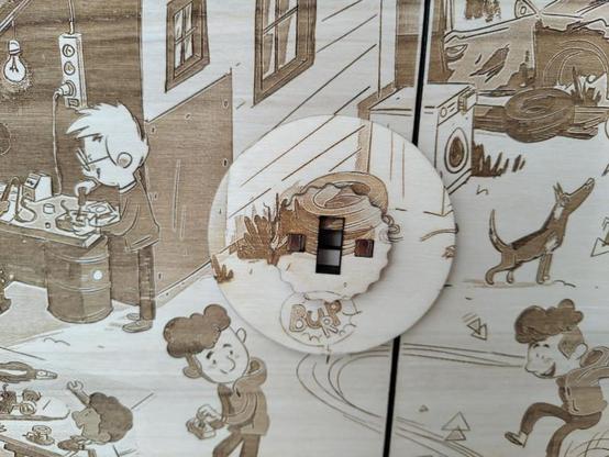 Detail of the doors showing the locking system, with the scene also engraved ; a key hole lets the spectators unlock the world of the Kamishibai !