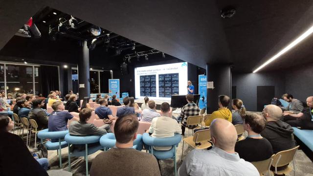 Hugo presenting a slide titled "3.14: more colour: python -m calendar".