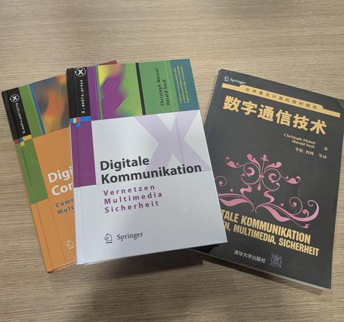The three issues of the book "Digital Communication" by Harald Sack and Christoph Meinel in English, German, and Chinsese.