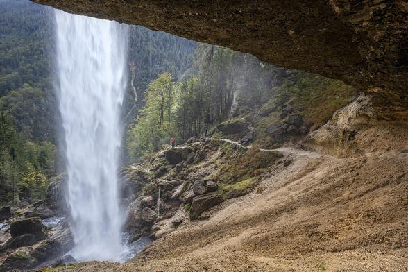 The Pericnik waterfall in Slovenia cascades down from an overhanging cliff onto a rocky landscape surrounded by lush green forest. It is one of the highest waterfalls in Slovenia. 

https://joan-carroll.pixels.com/featured/behind-pericnik-waterfall-slovenia-2-joan-carroll.html

#slovenia #waterfalls #landscape #landscapephotography #nature #forest #falls #rocky #cavern #cliff #AYearForArt #buyIntoArt #giftideas #wallart #artforsale @joancarroll