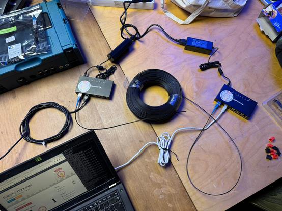 Two routers connected via fiber optic cable, one acting as uplink for the other.
The second router acts as media converter for a laptop connected to it.

Both running gluon, freifunk.