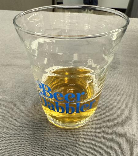 That same glass with a darker golden beer
