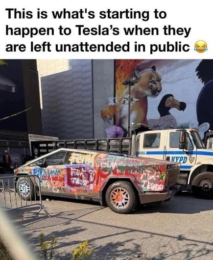A Tesla Cybertruck covered in colorful graffiti, including various tags, symbols, and phrases, parked on a street in front of an NYPD truck. The vehicle appears heavily vandalized with spray paint covering its metallic surface. A large mural featuring a cougar and a young girl with a bird is visible in the background. The image includes a humorous caption suggesting this is what happens to Teslas when left unattended in public.