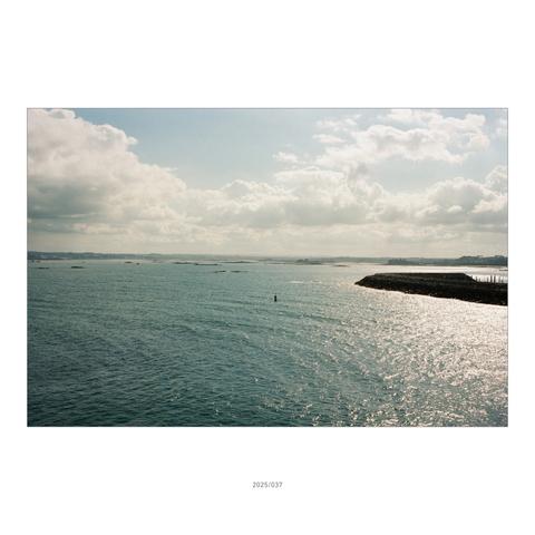 I'm standing on the ferry between Roscoff and Plymouth, looking back towards Brittany. You can still make out the fine coastline on the horizon.