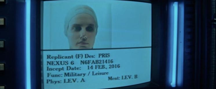 A screen surrounded by blue neon light. On it is a photo of a white woman's face. The text reads, "Replicant (f). Des: Pris. Nexus 6. N6FAB21416. Incept Date: 14 Feb, 2016. Function: military/leisure. Phys: Lev. A. Ment: Lev B.