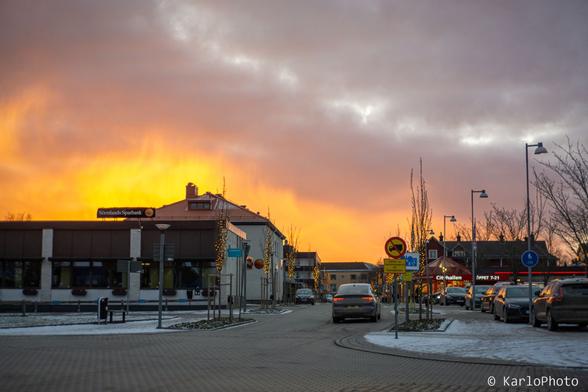 An orange sunset over a small town.