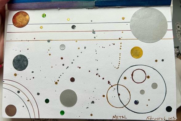 An abstract collage with circles of varying sizes that are punched from papers that are silver or prismatic and papers that were dyed with gold, copper, or silvery blue ink. Lines, circles, and arcs have also been drawn on using silver, copper, and gold inks. Ink has also been splattered across the surface in several places. Diamine Fools Gold, Vintage Copper, and Snow Storm were used.