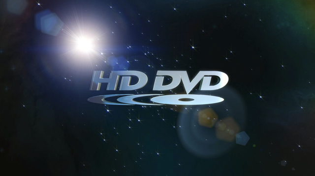Capture of a loading video for an HD DVD movie, Friday Night Lights by Universal, in this case. Shown is the HD DVD logo, name over a disc with two duplicated disc arcs on the left, in front of a star background with a lens flare stretching out to the top left and bottom right from a bright star just top-left from the "H" in the logo.