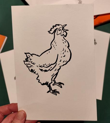 Photo d'un dessin NB de poule qui l'ouvre bien grand