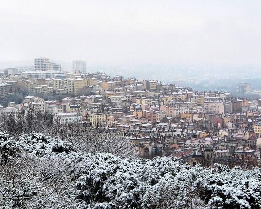 City view seeing from the top of the Fourvière hill in Lyon, showing the city buildings under a blanket of snow