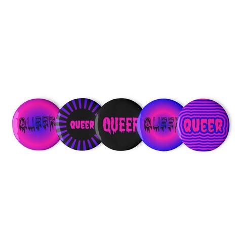 Set of 5 queer pride pin buttons in pink and blue cotton candy colors. From left to right:

1. The word "QUEER" in horror style dripping black font with a hot pink and blue background.
2. A black circle in the center with the word "QUEER" in creepy hot pink letters. There are black and blue/purple circus style stripes surrounding the circle.
3. The word "QUEER" in hot pink dripping font with a blue outline and a black background.
4. A bright pink and blue moon shaped design with the word "QUEER" in horror style dripping black font.
5. The word "QUEER" in creepy, hot pink font and outlined in black. It's surrounded by a psychedelic pink and blue outline.