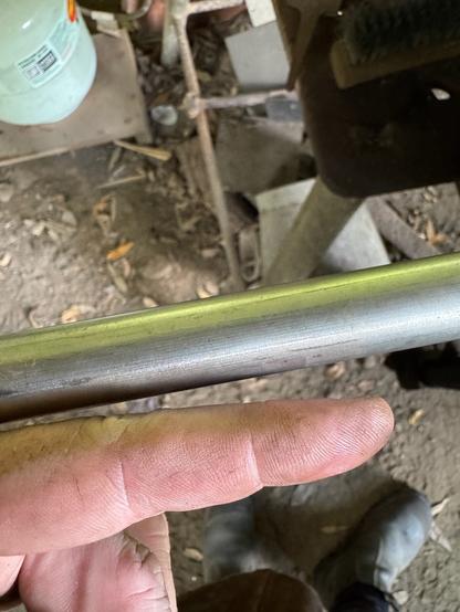 A round bar of silver looking engineering grade stainless steel (salvaged material) about as thick as my finger.