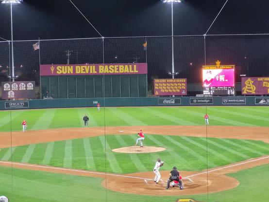 A photo of the ASU Sun Devil baseball team batting against Ohio St. in the baseball season opener.