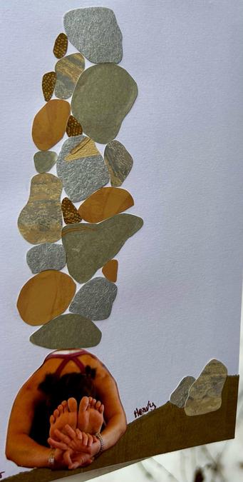 A close up of the person and the stones. It’s easier to see the different colors and textures of the wallpaper.