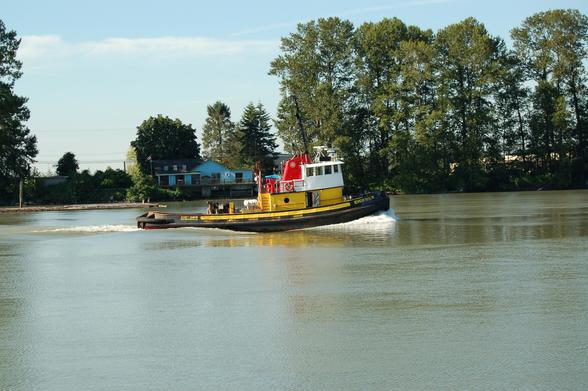 Tugboat heading down river