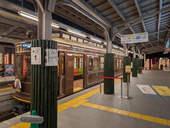 an old timey brown train cart, operating in kyoto (side view)