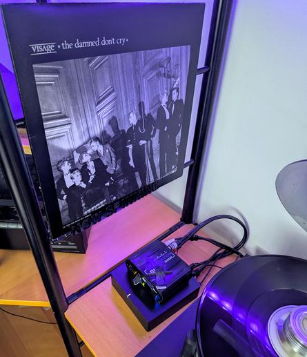 The usual picture of the turntable spinning the EP with the album cover in the background.