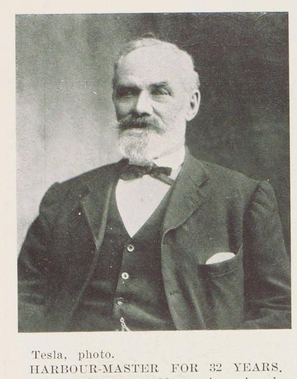 Black-and-white portrait photo: Harbour-master for 32 years. 1911. Description: Portrait of Captain Irvine, who has resigned from the position of Wanganui harbour-master. He wears a suit with a narrow bow tie and has short hair with a full beard. Citation: The New Zealand Graphic and Ladies Journal, 8 February 1911, p. 26. Auckland Libraries Heritage Collections NZG-19110208-0026-01. https://kura.aucklandlibraries.govt.nz/digital/collection/photos/id/149650