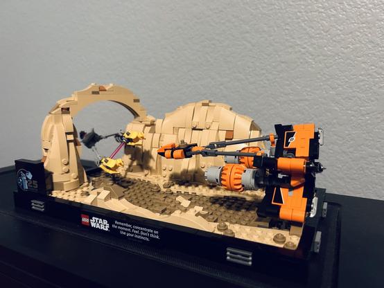 Photograph of a Lego Star Wars diorama depicting Anakin Skywalker and Sebulba’s pod racers in the Boonta Eve Classic pod race in Mos Espa on Tatooine.