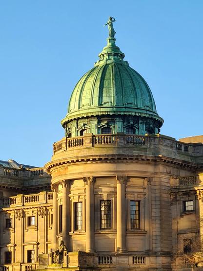 An Edwardian Baroque library building topped by a green metal dome.