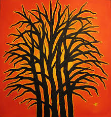Creative painting of the drak brown sihouettes of leaveless trees to a red backgroun