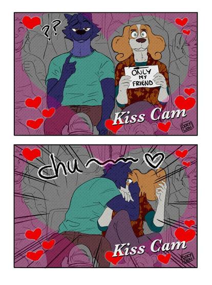 It's a comic: 
A Kiss Cam is happening.
In the first panel Lupin and Belfort appear. Belfort holds a sign with an arrow pointing to Lupin and "ONLY MY FRIEND" written on it.
In the second panel Lupin kisses Belfort.