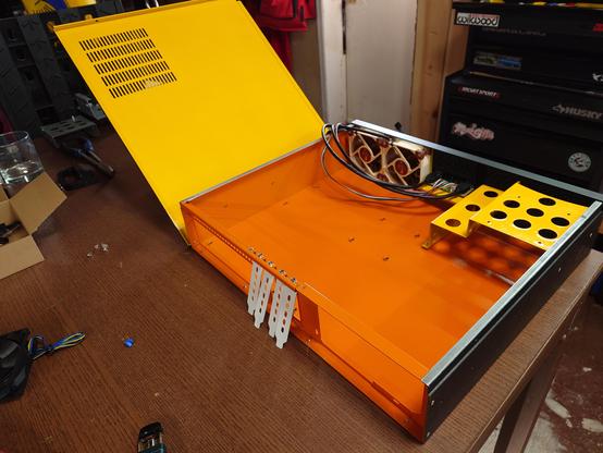 2U Server case, black exterior, orange inside with some yellow bits and yellow counter to the lid