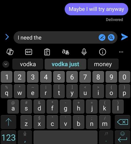 A picture of a SwiftKey keyboard with the already typed "I need the". SwiftKey's next words suggestions are: vodka, vodka just, and money.