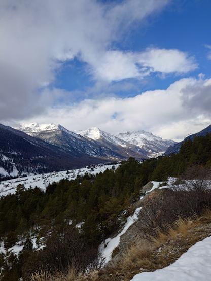 A view of the snowy mountains in Névache from the first part of the ascending road leading to Col de L'échelle