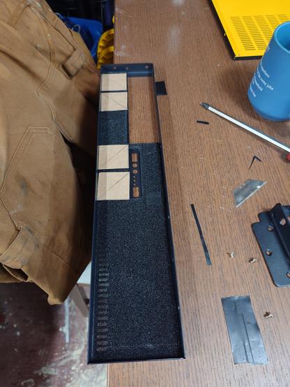 Front bezel of a 2U server, 40mm cardboard squares mark out room for 4 small fans across the top