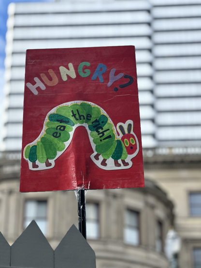 Hungry, hungry caterpillar cover but it says “hungry? Eat the rich”