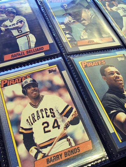 A closeup of 1990's Topps Baseball cards - Pittsburgh Pirates - Rafael Belliard, Jose Lind, Barry Bonds and Bobby Bonilla.