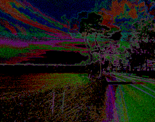 Psychedelic landscape of many different colors, made up of 4x4 pixel circular cells like an old CRT computer monitor