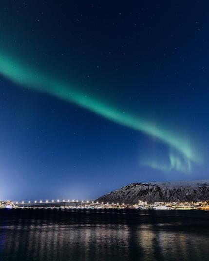 Northern Lights as seen from city center in Tromsø.