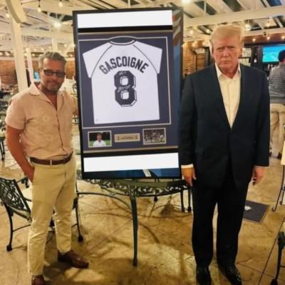 Seller and Trump in front of a framed Paul Gascoigne (Gaza) football shirt