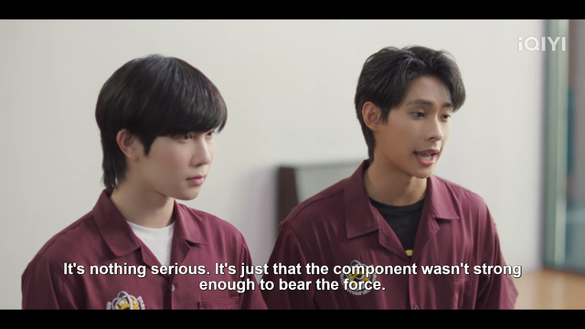 Yim and Tutor as Syn and Nuer in Cutie Pie. They both stand at the in a classroom, wearing burgundy button-down engineering shirts.

As indicated by captions, Nuer says: "It's nothing serious. It's just that the component wasn't strong enough to bear the force."