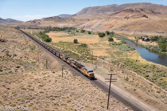 On Saturday August 3, 2019, I spent an awesome day chasing trains with my friend Ken Compton. At 2 p.m. a Union Pacific (UP) eastbound empty coal train had UP 2630, 8456 and 2599 as power. The train was in the Painted Rack Road area west of Fernley, Nevada.
UP 2630 is a GE ES44AC, UP designation ET44AH. Reportedly, it was built in 2015, builders number 63638, from UP series 2570-2669.